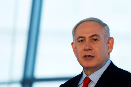 Israeli Prime Minister Benjamin Netanyahu speaks during the dedication ceremony of a new concourse at the Ben Gurion International Airport, near Lod, Israel February 15, 2018. REUTERS/Ronen Zvulun