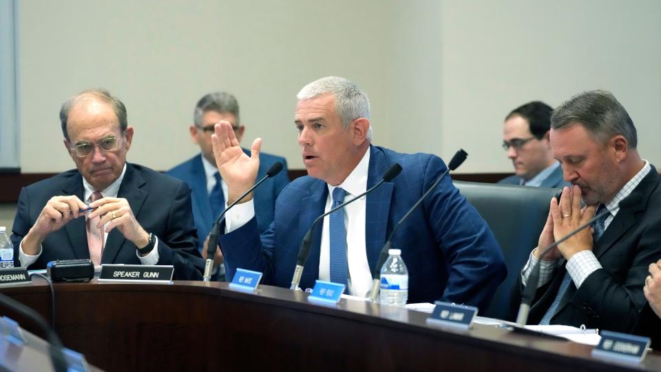 Mississippi House Speaker Philip Gunn, R-Clinton, center, discusses revenue estimates during a meeting of the Joint Legislative Budget Committee, Wednesday, Nov. 15, 2023, in Jackson, Miss. Lt. Gov. Delbert Hosemann, left, and Speaker Pro Tempore Jason White, R-West, right, were among committee members participating in the discussion.