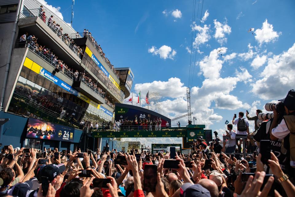 LE MANS, FRANCE - JUNE 11: The podium (L to R): Kamui Kobayashi of Japan and Toyota Gazoo Racing Team Principal; Ryo Hirakawa of Japan, Brendon Hartley of New Zealand, Sebastien Buemi of Switzerland #08 Toyota Gazoo Racing, second; Antonello Coletta of Italy and Head of Ferrari Attivita Sportive GT; Antonio Giovinazzi of Italy, Alessandro Pier Guidi of Italy, James Calado of Great Britain #51 AF Corse Ferrari, race winners; Earl Bamber of New Zealand, Alex Lynn of Great Britain, Richard Westbrook of Great Britain #02 Cadillac Racing, third, at the 100th anniversary of the 24 Hours of Le Mans at the Circuit de la Sarthe on June 11, 2023 in Le Mans, France. (Photo by James Moy Photography/Getty Images)