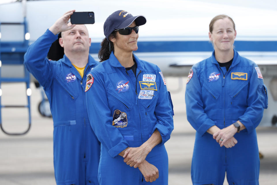 NASA astronaut Suni Williams with support crew in the background speaks to the media after arriving at the Kennedy Space Center, Thursday, April 25, 2024, in Cape Canaveral, Fla. The two test pilot crew will launch aboard Boeing’s Starliner capsule atop an Atlas rocket to the International Space Station, scheduled for liftoff on May 6, 2024. (AP Photo/Terry Renna)