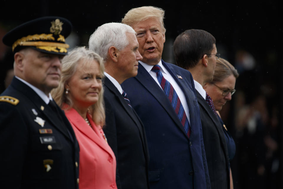 President Donald Trump talks with Vice President Mike Pence during an Armed Forces welcome ceremony for the new chairman of the Joint Chiefs of Staff Gen. Mark Milley, Monday, Sept. 30, 2019, at Joint Base Myer-Henderson Hall, Va. From left, Milley, Hollyanne Milley, Pence, Trump, Defense Secretary Mark Esper, and Leah Esper. (AP Photo/Evan Vucci)