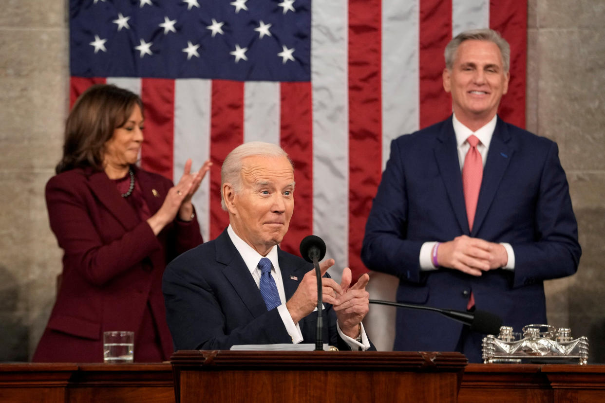 President Joe Biden gestures as he delivers the State of the Union address to a joint session of Congress at the U.S. Capitol, Tuesday, Feb. 7, 2023, in Washington, as Vice President Kamala Harris and House Speaker Kevin McCarthy of Calif., watch.  Jacquelyn Martin/Pool via REUTERS