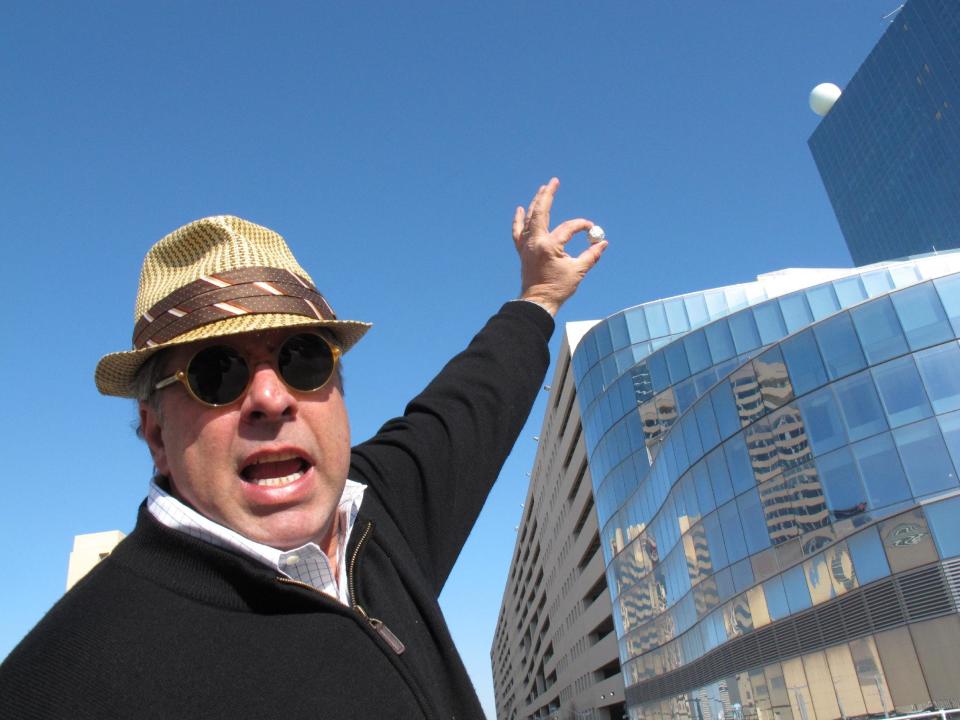 Mitch Gorshin, an executive with Revel Entertainment, holds the crumpled up ball of tinfoil that inspired him to design the iconic ball atop the soon-to-open Revel casino in Atlantic City, N.J. on March 7, 2012, the first day the ball was fully illuminated during testing. Gorshin's father Frank played "The Riddler" on the "Batman" TV series. (AP Photo/Wayne Parry)