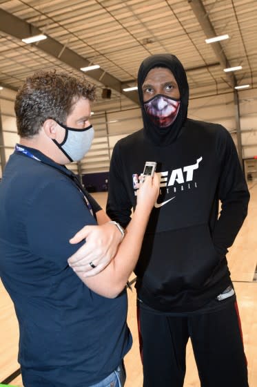 Times reporter Dan Woike interviews Heat star Jimmy Butler during a practice.