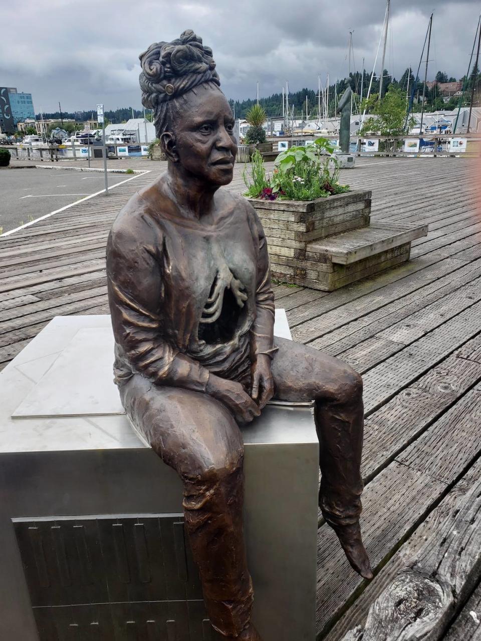 Aisha Harrison’s “Woman With Graves at Her Back” was part of the 2021 Percival Plinth Project. It won the People’s Choice Award, and on Tuesday, the Olympia City Council authorized the purchase of the sculpture for its permanent public art collection.