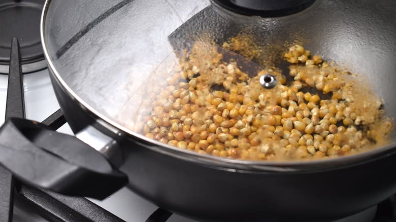 kernels in pan on stove