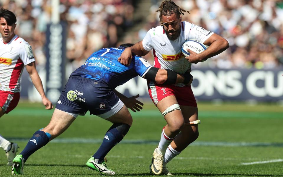 Chandler Cunningham-South of Harlequins is tackled by Lekso Kaulashvili during the Investec Champions Cup Quarter Final match between Union Bordeaux Begles and Harlequins at Stade Chaban-Delmas on April 13, 2024 in Bordeaux, France