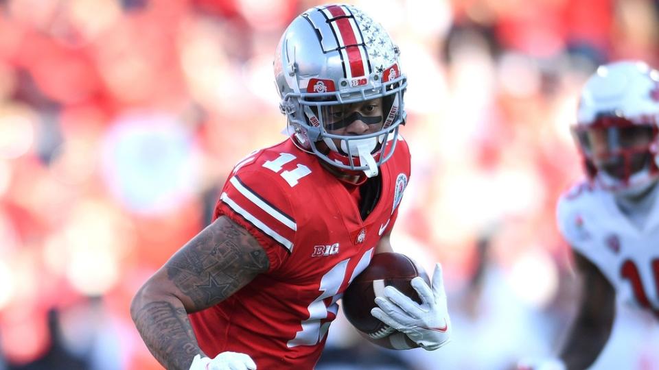 Jan 1, 2022;  Pasadena, CA, USA;  Ohio State Buckeyes wide receiver Jaxon Smith-Njigba (11) runs with the ball after making a catch against the Utah Utes during the 2022 Rose Bowl college football game at the Rose Bowl.