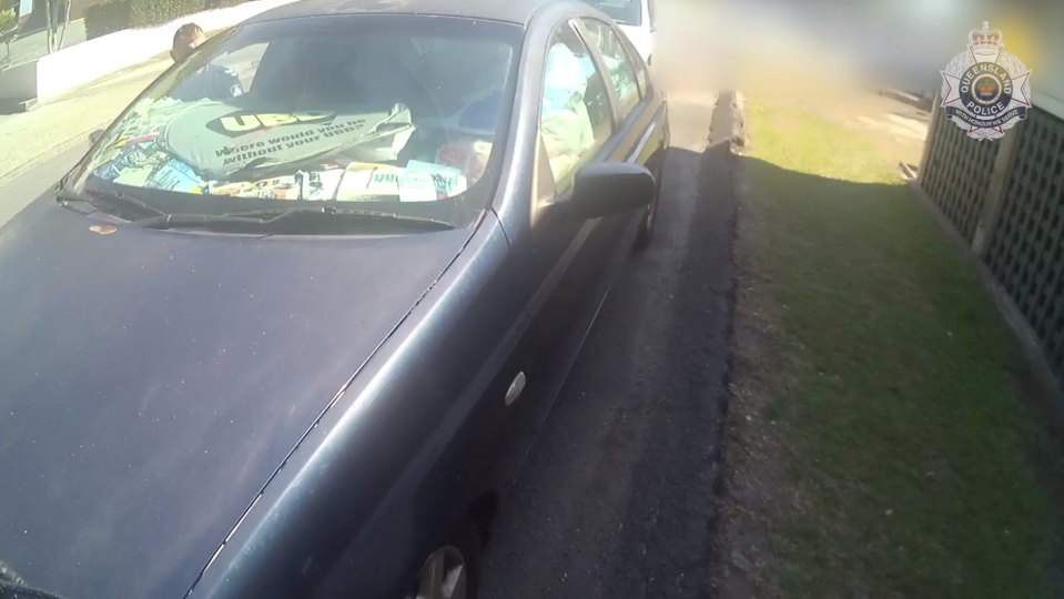 Clutter fills up the front window of a car pulled over in Upper Mount Gravatt. The driver was pulled over because police said he couldn't see out his rear or side windows.