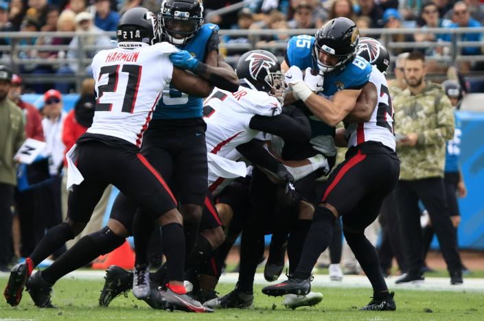 Jaguars tight end Dan Arnold (85) is stopped by the Atlanta Falcons defense during the second quarter Sunday.