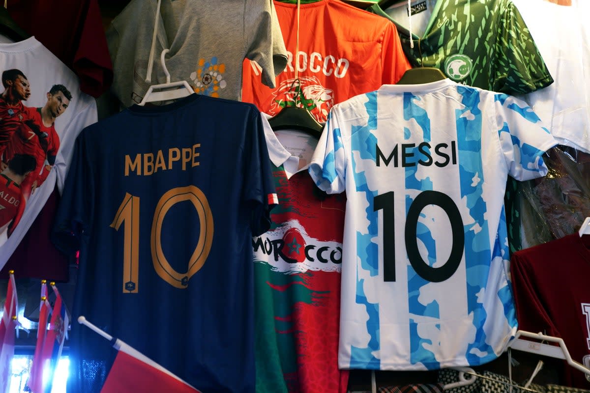 A France and Argentina shirt hang in a market stall in the Souq area of Doha. Reigning champions France will play Argentina in Sunday�s World Cup final. Picture date: Saturday December 17, 2022. (PA Wire)