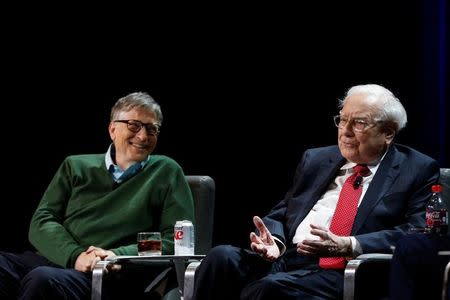 Warren Buffett, chairman and CEO of Berkshire Hathaway, speaks while Bill Gates looks on at Columbia University in New York, U.S., January 27, 2017. REUTERS/Shannon Stapleton