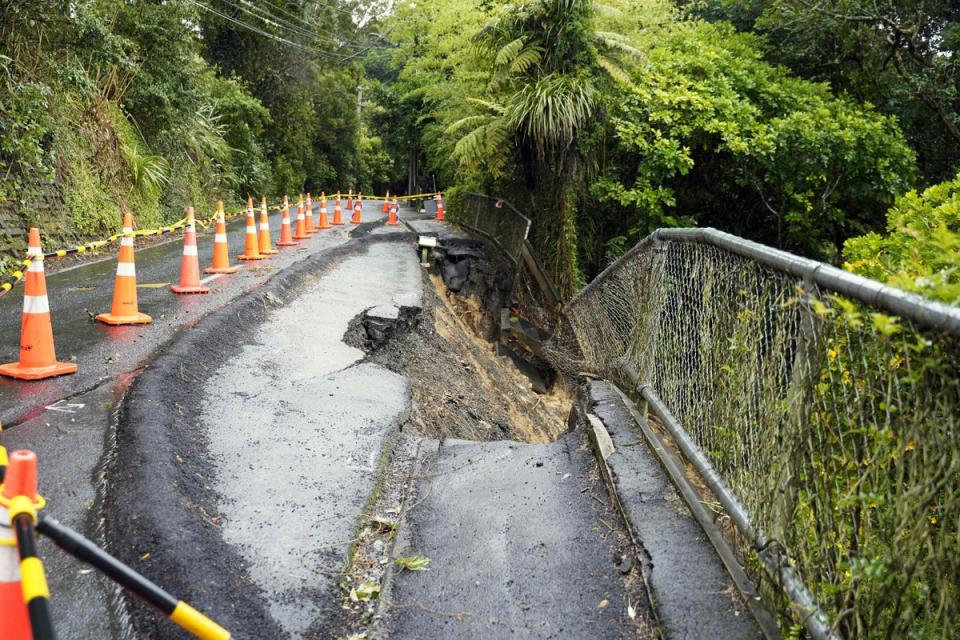 A general view of a damaged road after a storm battered Titirangi, a suburb of New Zealand's West Auckland area (AFP via Getty Images)