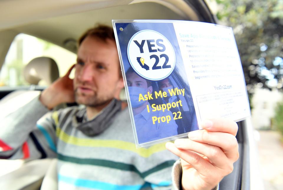 Uber driver Sergei Fyodorov discusses why he supports a yes vote on Proposition 22 in Oakland, California on October 9, 2020. - Ahead of a referendum that could upend the whole gig economy, Uber driver Karim Benkanoun says his relationship with the rideshare giant must stop being a one-way street. "If youre a driver with Uber or Lyft, you're nothing," said Benkanoun as he speaks of how he will vote in California's Proposition 22 referendum. (Photo by JOSH EDELSON / AFP) (Photo by JOSH EDELSON/AFP via Getty Images)