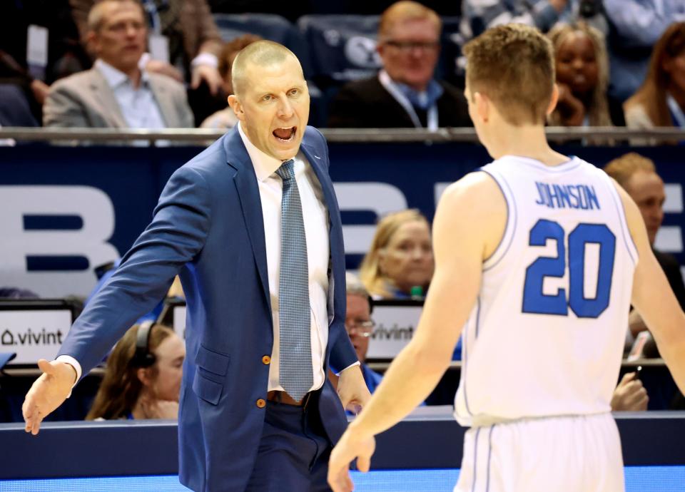 BYU men’s head basketball coach Mark Pope low-fives Brigham Young Cougars guard Spencer Johnson (20) during a men’s basketball game at the Marriott Center in Provo on Friday, Dec. 22, 2023. BYU won 101-59. | Kristin Murphy, Deseret News