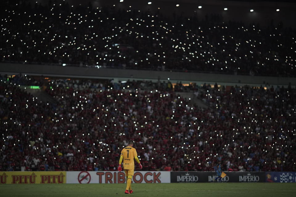 Flamengo's goalkeeper wears a jersey with the name of the young goalkeeper Christian, one of the 10 teenage players killed by a fire at the Flamengo training center last Friday, ahead of a soccer match between Flamengo and Fluminense, at the Maracana Stadium, in Rio de Janeiro, Brazil, Thursday, Feb. 14, 2019. (AP Photo/Leo Correa)