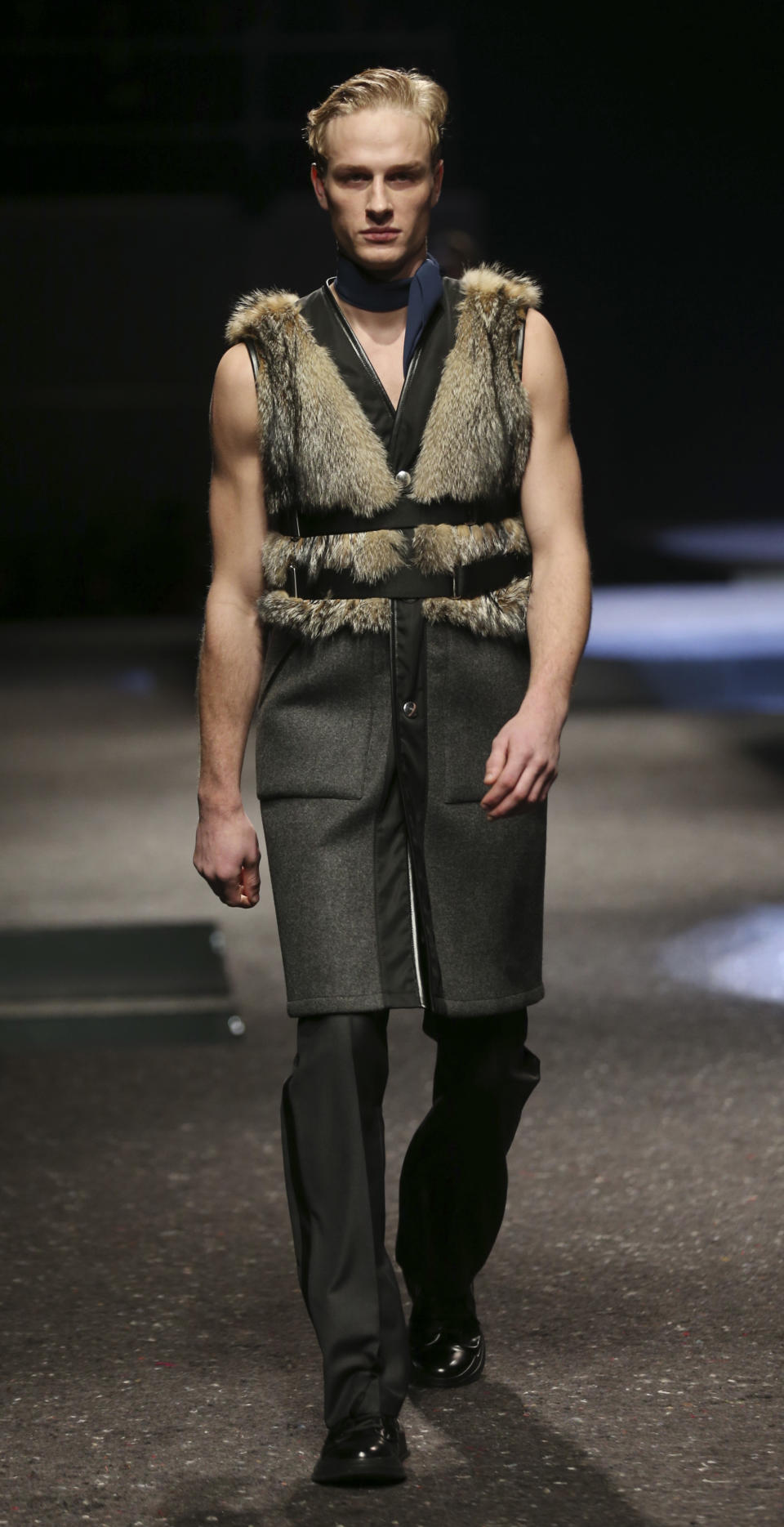 A model wears a creation for Prada men's Fall-Winter 2014 collection, part of the Milan Fashion Week, unveiled in Milan, Italy, Sunday, Jan.12, 2014. (AP Photo/Luca Bruno)