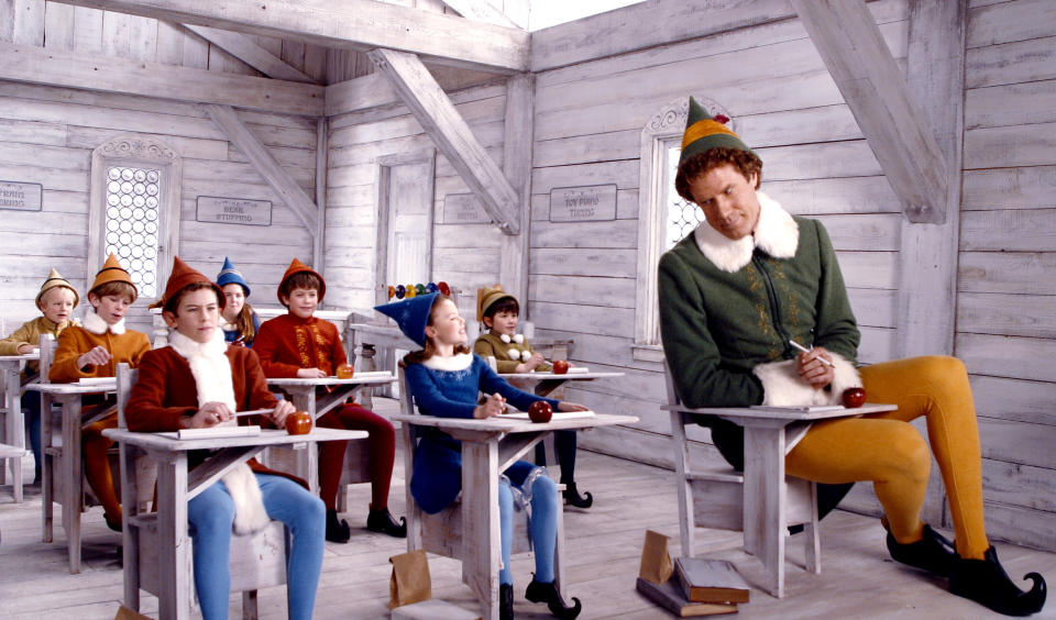 Will Ferrell sitting in a classroom with elves.