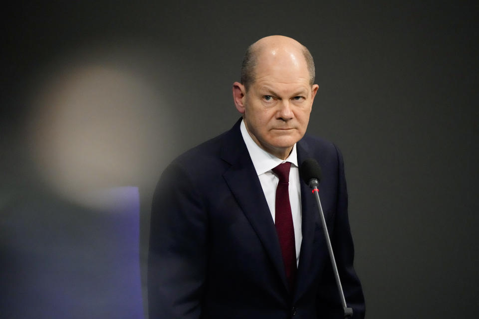 German Chancellor Olaf Scholz answers questions about mandatory vaccination from a lawmaker of the Alternative for Germany, AfD, party during a session of the Parliament Bundestag in Berlin, Germany, Wednesday, Jan. 12, 2022. (AP Photo/Markus Schreiber)