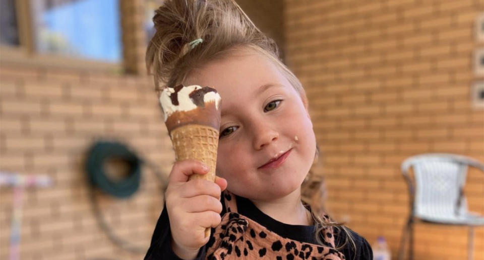 Cleo Smith holding up an ice cream to camera.