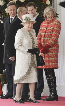 Britain's Home Secretary Theresa May, Deputy Prime Minister Nick Clegg and Prime Minister David Cameron watch as Queen Elizabeth arrives for the ceremonial welcome for Mexico's President Enrique Pena Nieto and his wife Angelica Rivera, at Horse Guards Parade in London, in this file photograph dated March 3, 2015. REUTERS/Leon Neal/pool/files