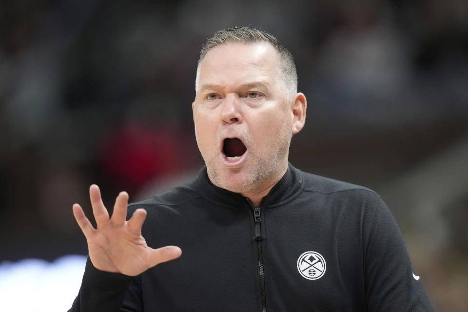 Denver Nuggets head coach Michael Malone shouts during in the first half of an NBA basketball game against the Utah Jazz Tuesday, April 9, 2024, in Salt Lake City. . (AP Photo/Rick Bowmer)