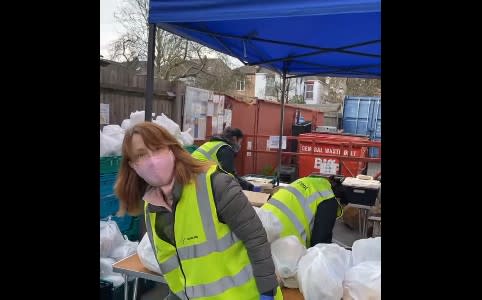 Kay Burley handing out food packages in North West London. (London's Community Kitchen/Facebook)