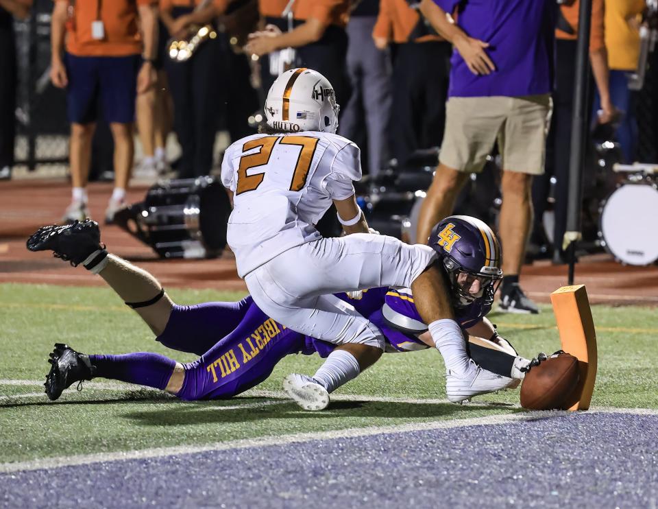 Liberty Hill running back Noah Long stretches the ball for a touchdown just before halftime in Friday night's wild 82-80 win over Hutto. Long finished the night with 297 yards.