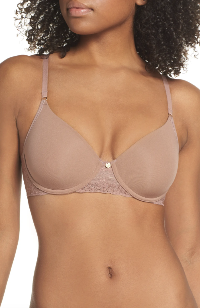 black model with curly hair wearing beige brown Natori Bliss Perfection Underwire Contour Bra in Cinnamon 