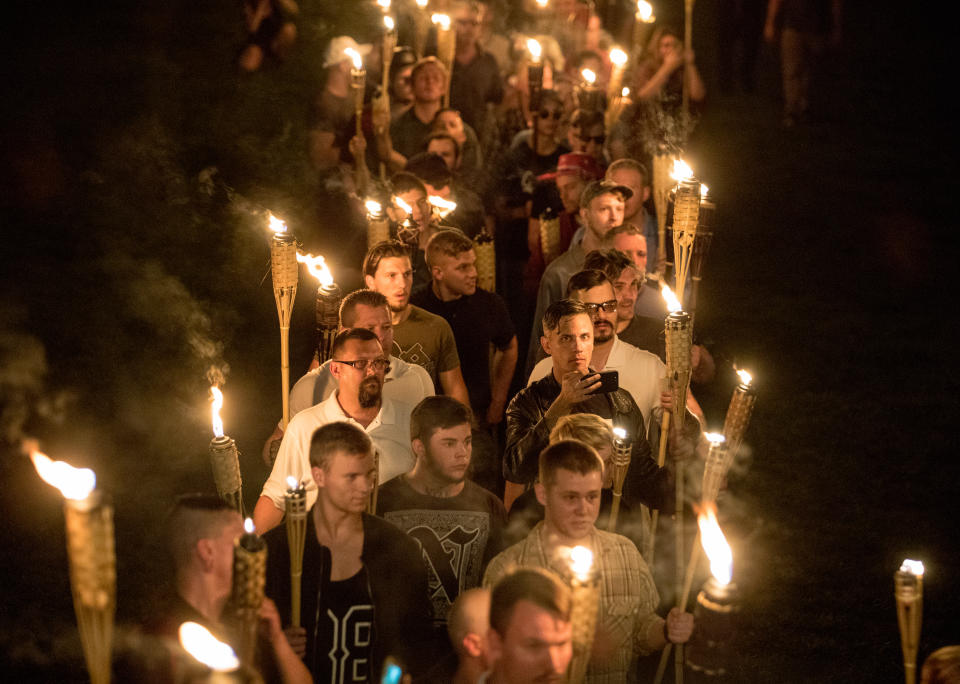 <p>Chanting “White lives matter! You will not replace us! and Jews will not replace us!,” several hundred white nationalists and white supremacists carrying torches marched in a parade through the University of Virginia campus in Charlottesville, Va., on Aug. 11, 2017. (Photo: Evelyn Hockstein/For The Washington Post via Getty Images) </p>