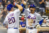 New York Mets' Brandon Nimmo (9) celebrates with Pete Alonso (20) after hitting a solo home run during the eighth inning of a baseball game against the Philadelphia Phillies, Saturday, Sept. 18, 2021, in New York. (AP Photo/Mary Altaffer)