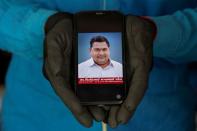 The Wider Image: Indians share the stories of loved ones they lost to the pandemic