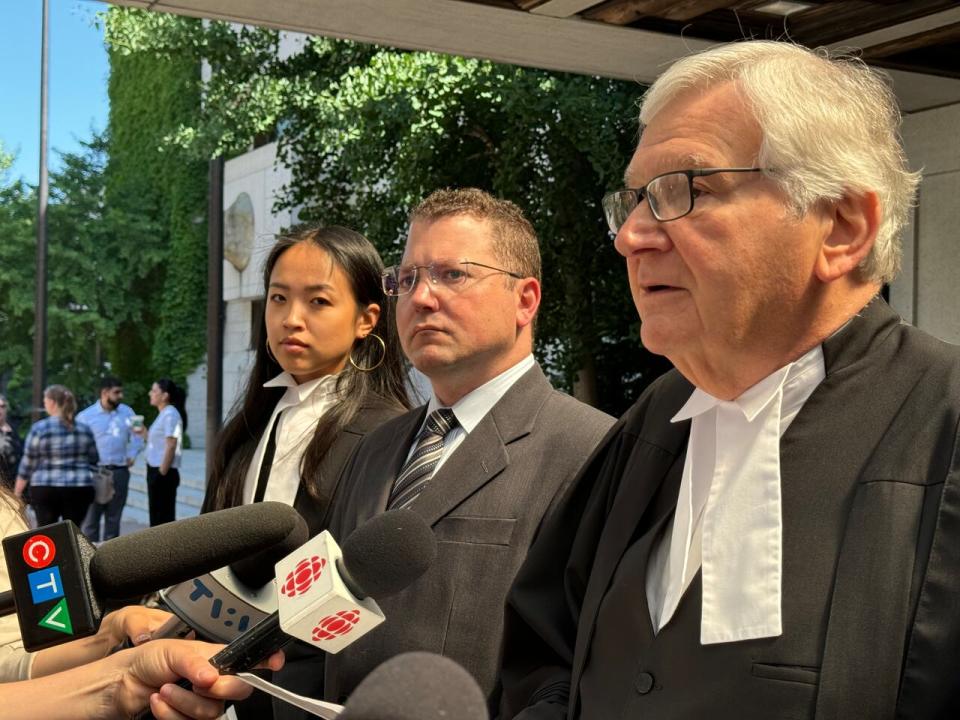 Dr. Brian Nadler, centre, with defence lawyers including Brian Greenspan, right, outside the Ottawa Courthouse on July 2, 2024.