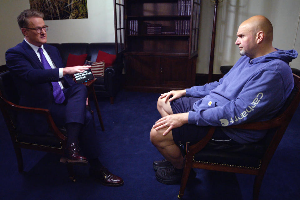 From left, Joe Scarborough interviews Sen. John Fetterman, D-Pa., on May 5, 2023. (NBC News)