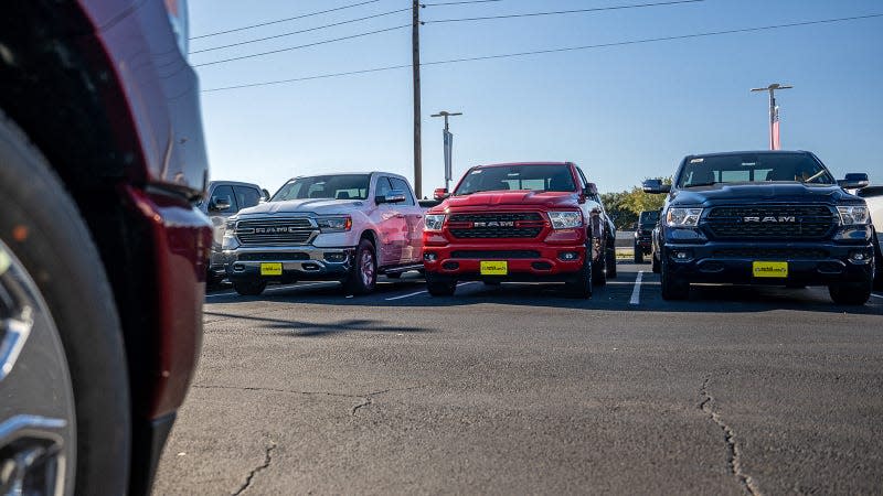 Ram trucks sit on a dealership lot