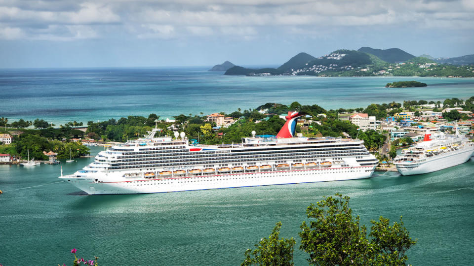 A Carnival Cruise Line ship docked in port.<p>Image source: Shutterstock</p>