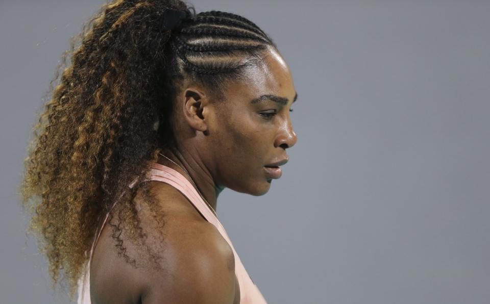 Serena Williams from the U.S. reacts during a match against her sister Venus, on the opening day of the Mubadala World Tennis Championship in Abu Dhabi, United Arab Emirates, Thursday, Dec. 27, 2018. (AP Photo/Kamran Jebreili)