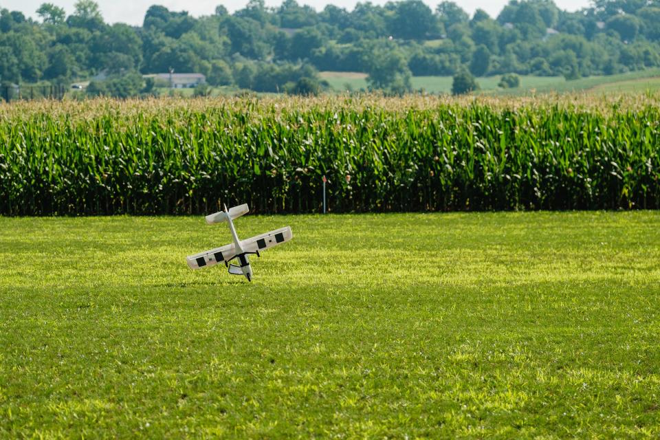 The first airplane of the day to fly crash lands after experiencing technical difficulties during the annual Academy of Model Aeronautics National Model Aviation Day hosted by the OldTown Valley Flyer's Club, Saturday, Aug. 12 on a private field in Lawrence Township.