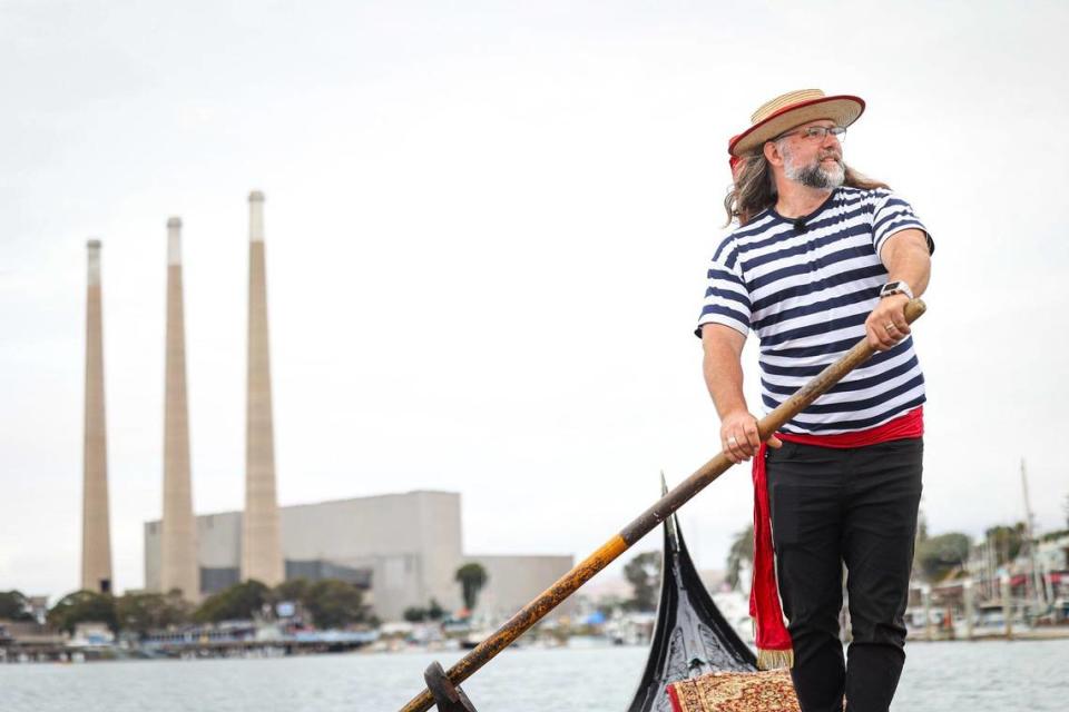 Central Coast Gondola owner Stephen Anastasia rows on the waters of Morro Bay in the Gianna, an elaborately carved and decorated Venetian wedding gondola, on Thursday, June 22, 2023.