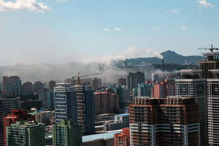 Smoke rises from a chimney in downtown Pyongyang, North Korea, September 7, 2018. REUTERS/Josh Smith/File Photo