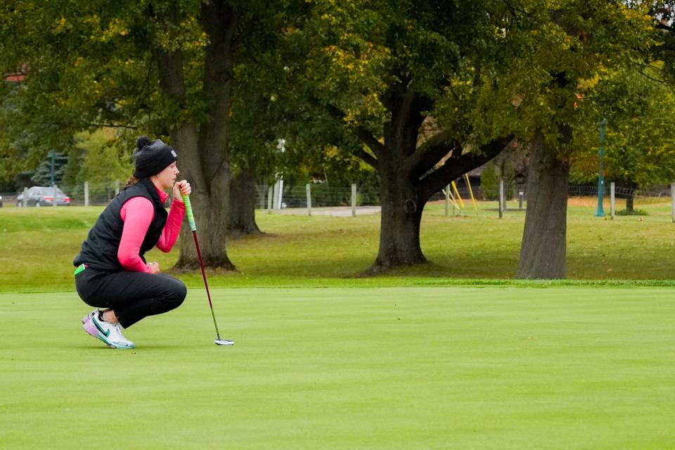 Lakota East senior Clare Yeazell contemplates her final shot on hole 18 at the OHSAA Division I girls golf state tournament. Saturday, October 21, 2023 at the Ohio State University Golf Club.