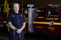 Fire Truck Captain Jeane Barrett of Los Angeles County Fire Department - Station 106 poses for a photo at her station Friday, Feb. 26, 2021, in Rancho Palos Verdes, Calif, a suburb of Los Angeles. She was among first responders at the scene of a vehicle crash involving golfer Tiger Woods on Tuesday. (AP Photo/Ashley Landis)