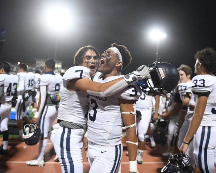 Vista Murrieta players celebrate after an upset 51-41 win over Murrieta Valley on Friday night.