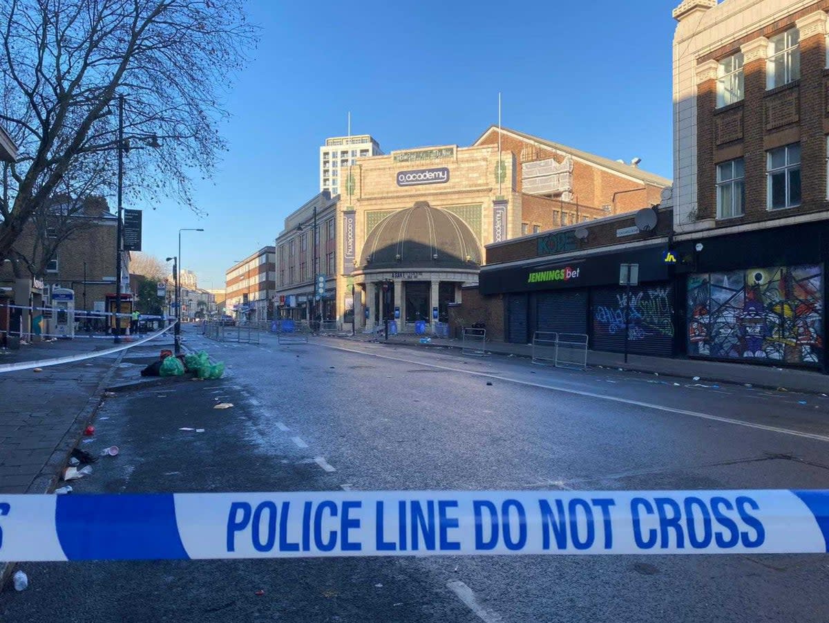 A police cordon remained in place on Friday (Mustafa Qadri / The Independent)