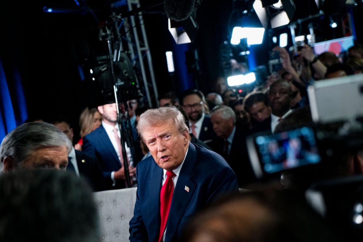 <span>Donald Trump speaks in the spin room following his debate with Kamala Harris in Philadelphia on Tuesday.</span><span>Photograph: Bonnie Cash/UPI/REX/Shutterstock</span>