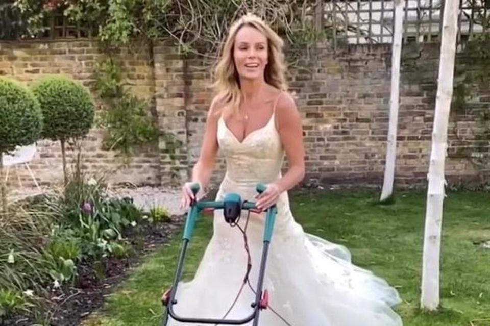 Amanda Holden mowing lawn in wedding dress (@noholdenback)