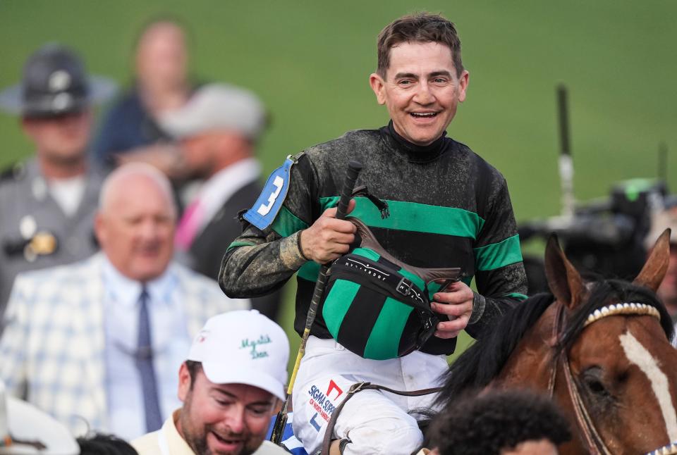 Jockey Brian J. Hernandez smiles aboard Mystik Dan as the two head to the Winner's Circle after winning the 2024 Kentucky Derby race at Churchill Downs Saturday, May 4, 2024 in Louisville, Kentucky.