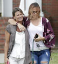 <p>A student and her mom leave a staging area for students at the First Baptist Church of Ocala after a shooting incident at nearby Forest High School, Friday, April 20, 2018, in Ocala, Fla. (Photo: John Raoux/AP) </p>