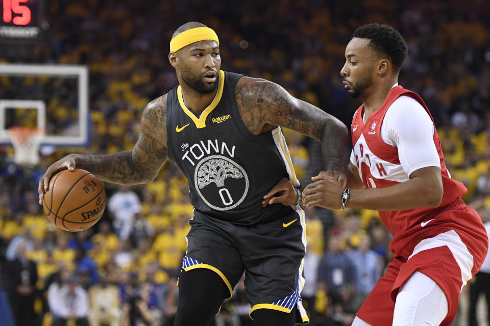 Golden State Warriors center DeMarcus Cousins (0) controls the ball as Toronto Raptors forward Norman Powell defends during the first half of Game 4 of basketball’s NBA Finals, Friday, June 7, 2019, in Oakland, Calif. (Frank Gunn/The Canadian Press via AP)