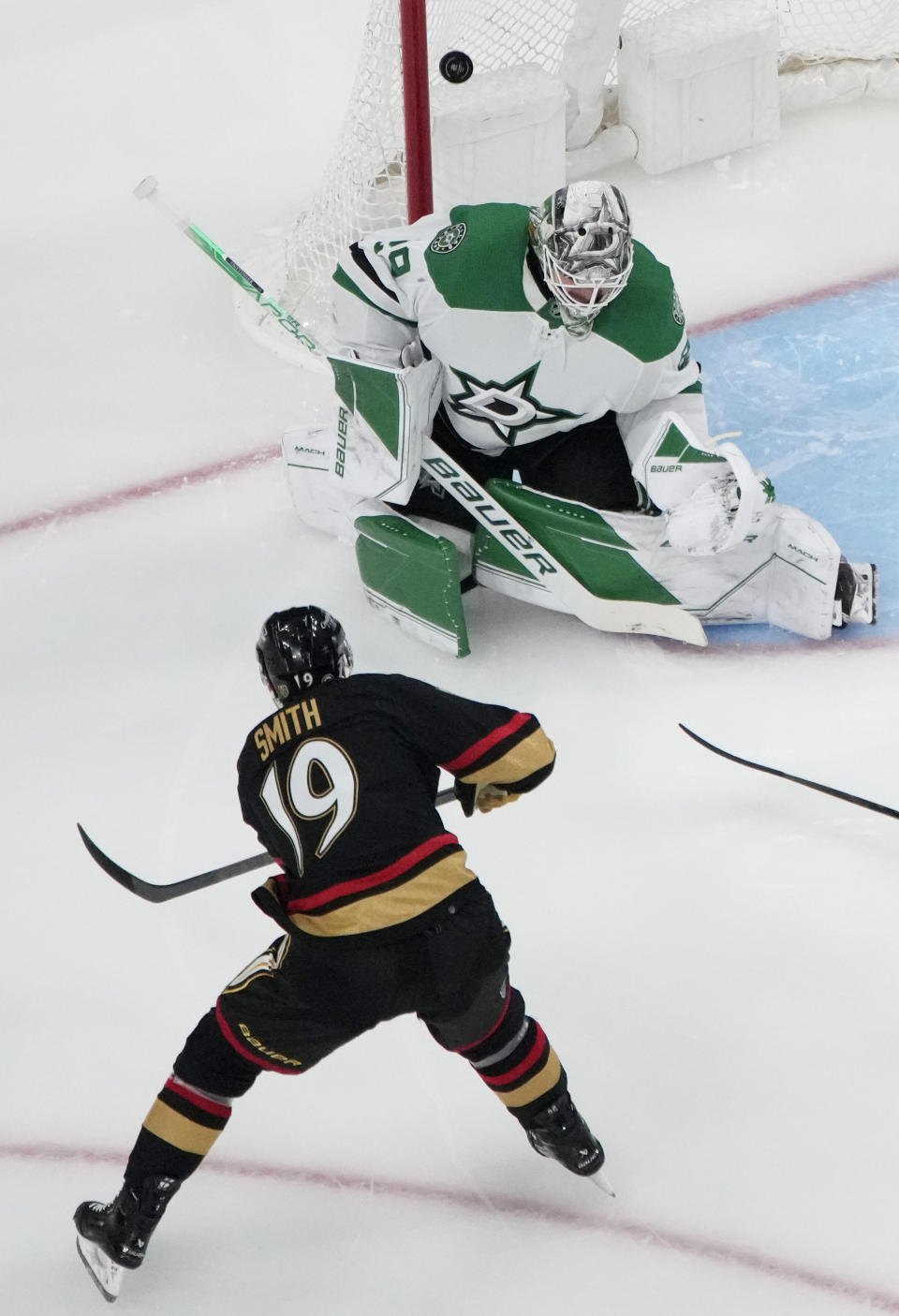 Vegas Golden Knights right wing Reilly Smith (19) attempts a shot on Dallas Stars goaltender Jake Oettinger (29) during the third period of an NHL hockey game Monday, Jan. 16, 2023, in Las Vegas. (AP Photo/John Locher)